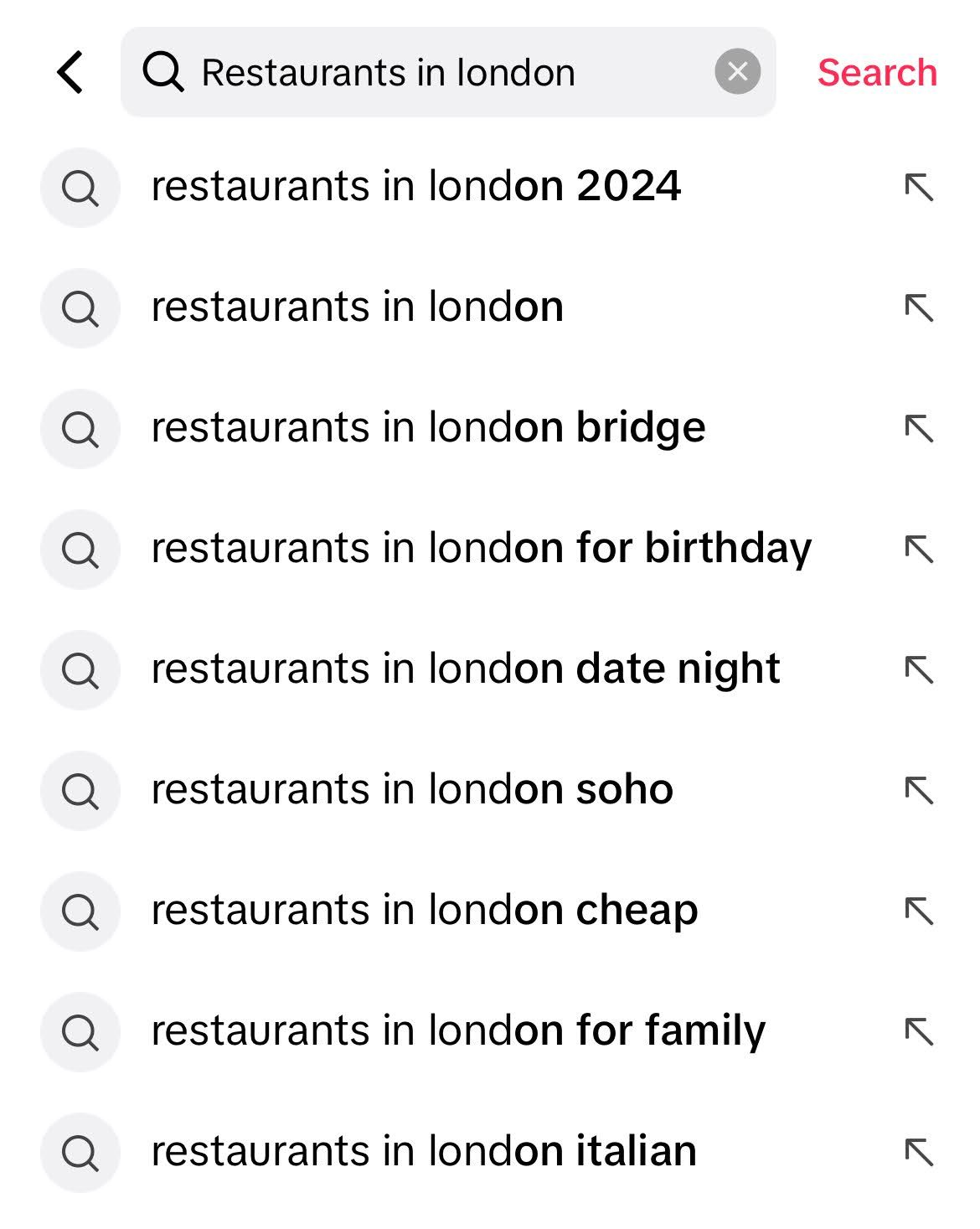 The TikTok search bar offers related searches