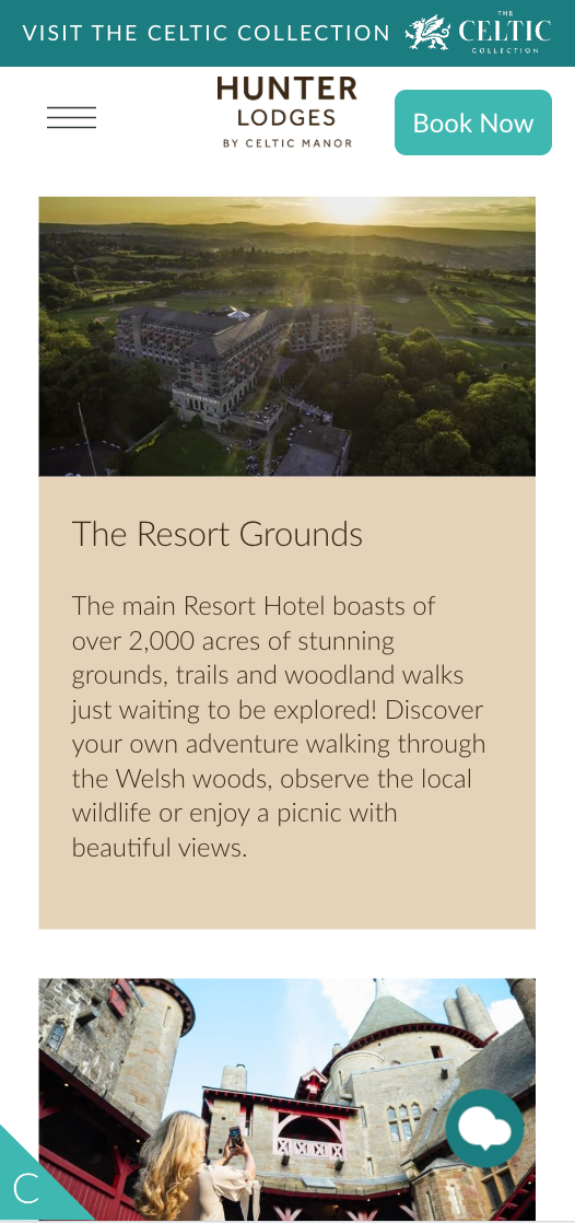 A resort hotel is shown from above, nestled in extensive grounds. The main Resort Hotel boasts of over 2,000 acres of stunning grounds, trails and woodland walks just waiting to be explored! Discover your own adventure walking through the Welsh woods, observe the local wildlife or enjoy a picnic with beautiful views. A woman photographs a castle.